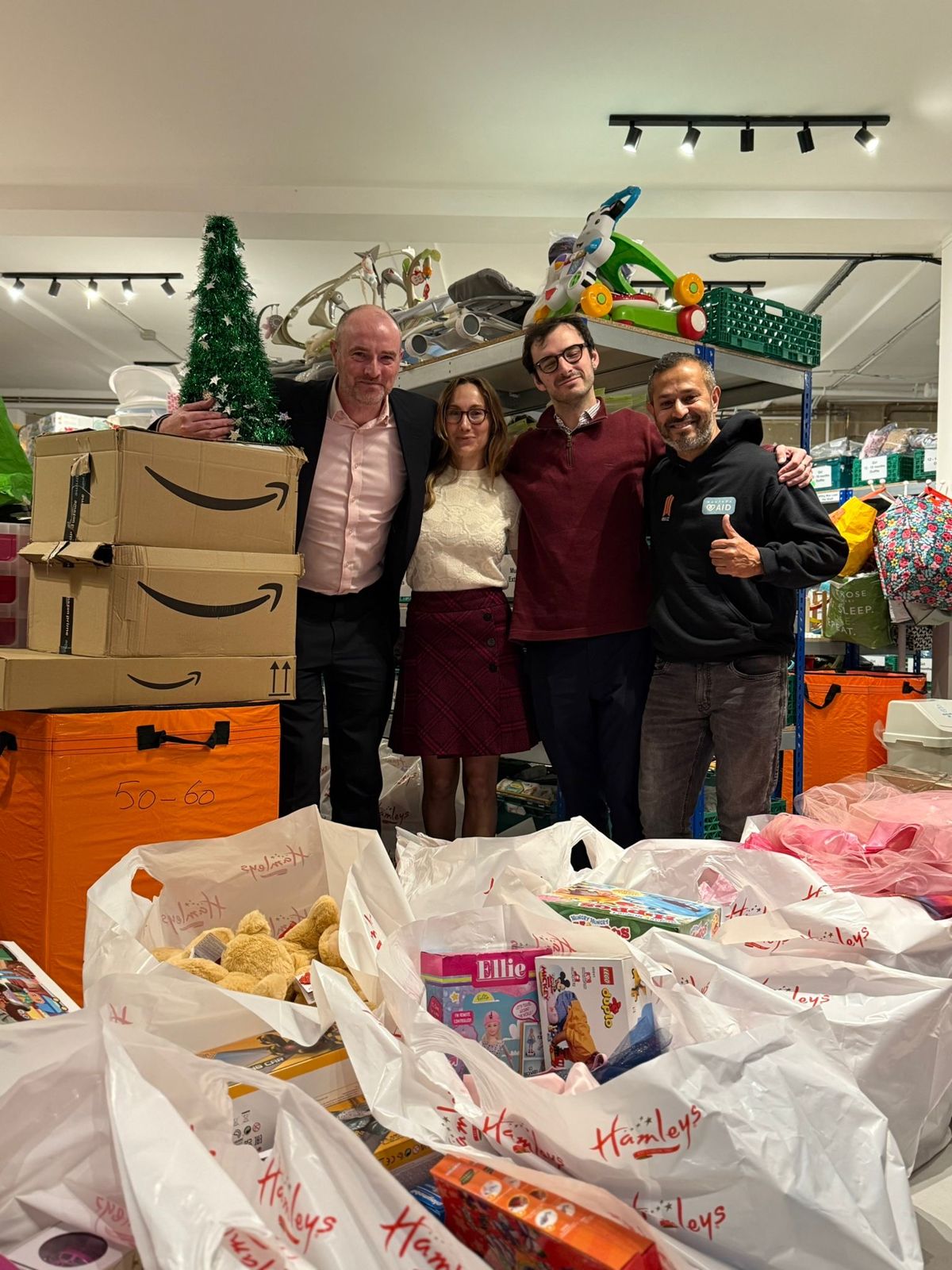 Community partners sorting bags of gifts in the baby bank