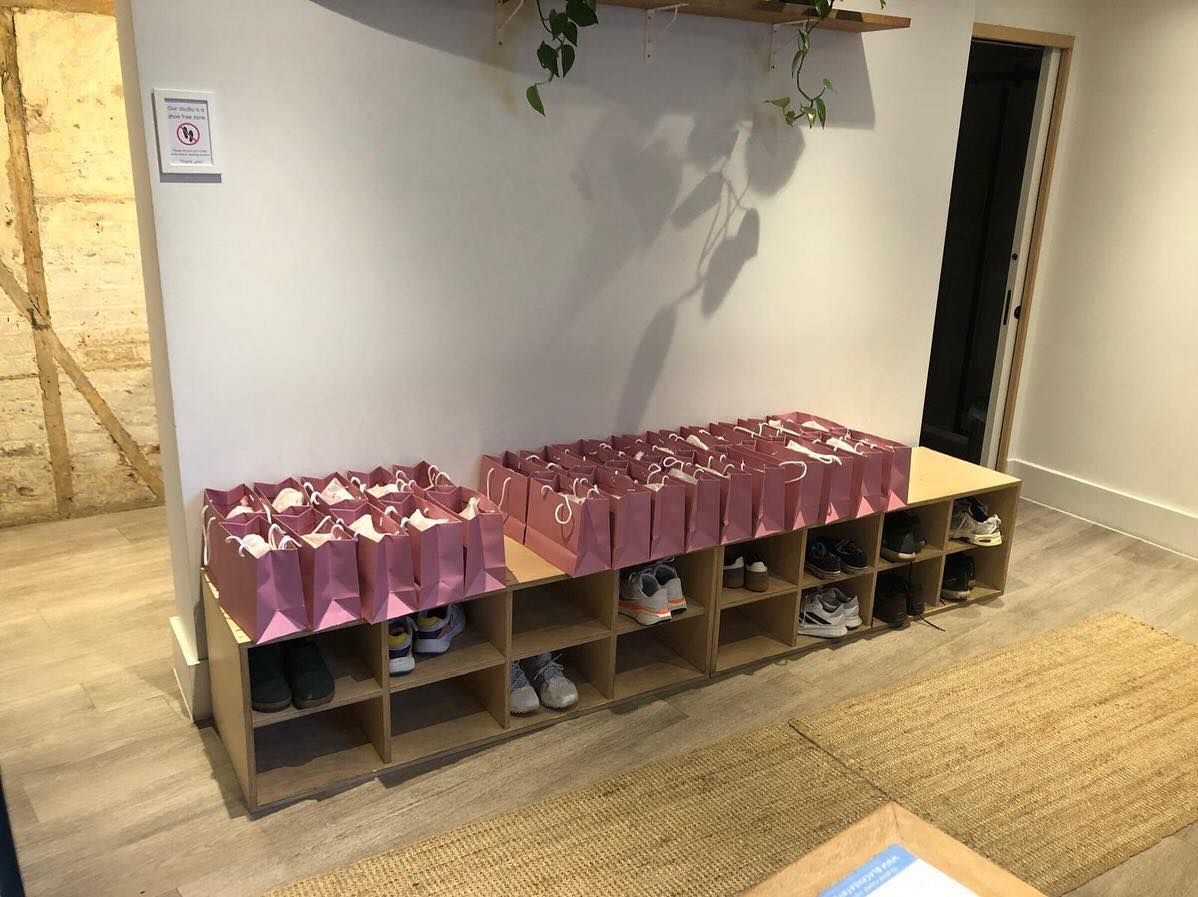 Family packs and shoes neatly arranged and ready for collection